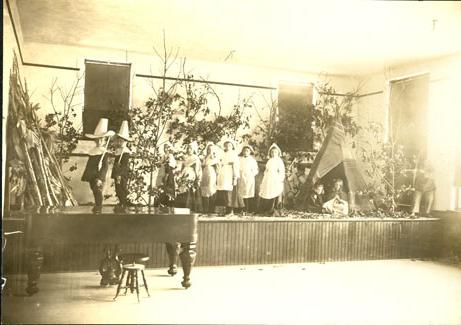 Training School children participate in a Thanksgiving play in 1908.  Northwest's Training School allowed Normal School students the chance to teach children, thus gaining practical experience.  The school evolved into the Horace Mann Laboratory School, which is a part of Northwest's Education department.  Horace Mann is now located in the Everett Brown building across from the J.W. Jones Union.