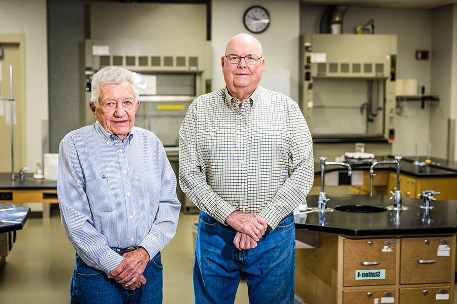 Dr. Harlan Higginbotham and Dr. Ed Farquhar are pictured in a Garrett-Strong Science Building laboratory. In addition to earning their bachelor's degrees from Northwest, both served as chemistry faculty for more than 35 years. (Photo by Lauren Adams/Northwest Missouri State University)  